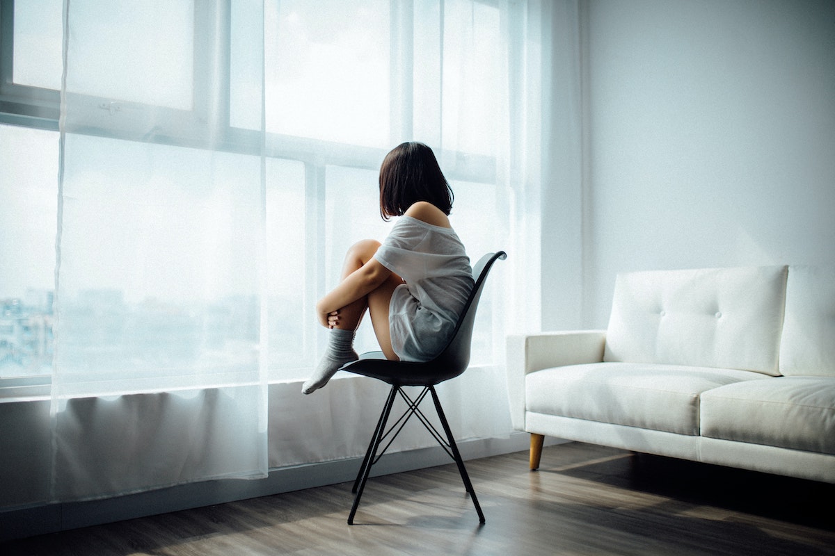 Woman sitting by the window